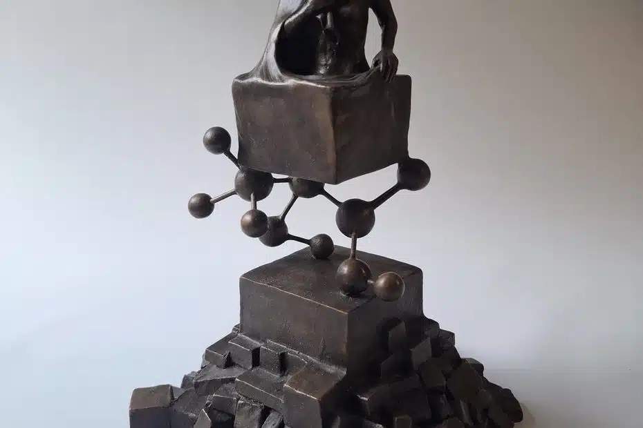 • LabNews AI Bronze sculpture of a shirtless man seated on a cube with a molecular like chain of spheres and rods below on a stepped base